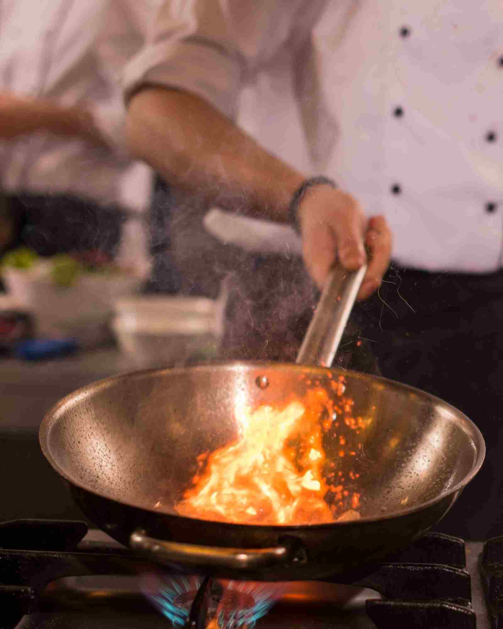 Head chef plating a fine-dining dish in France