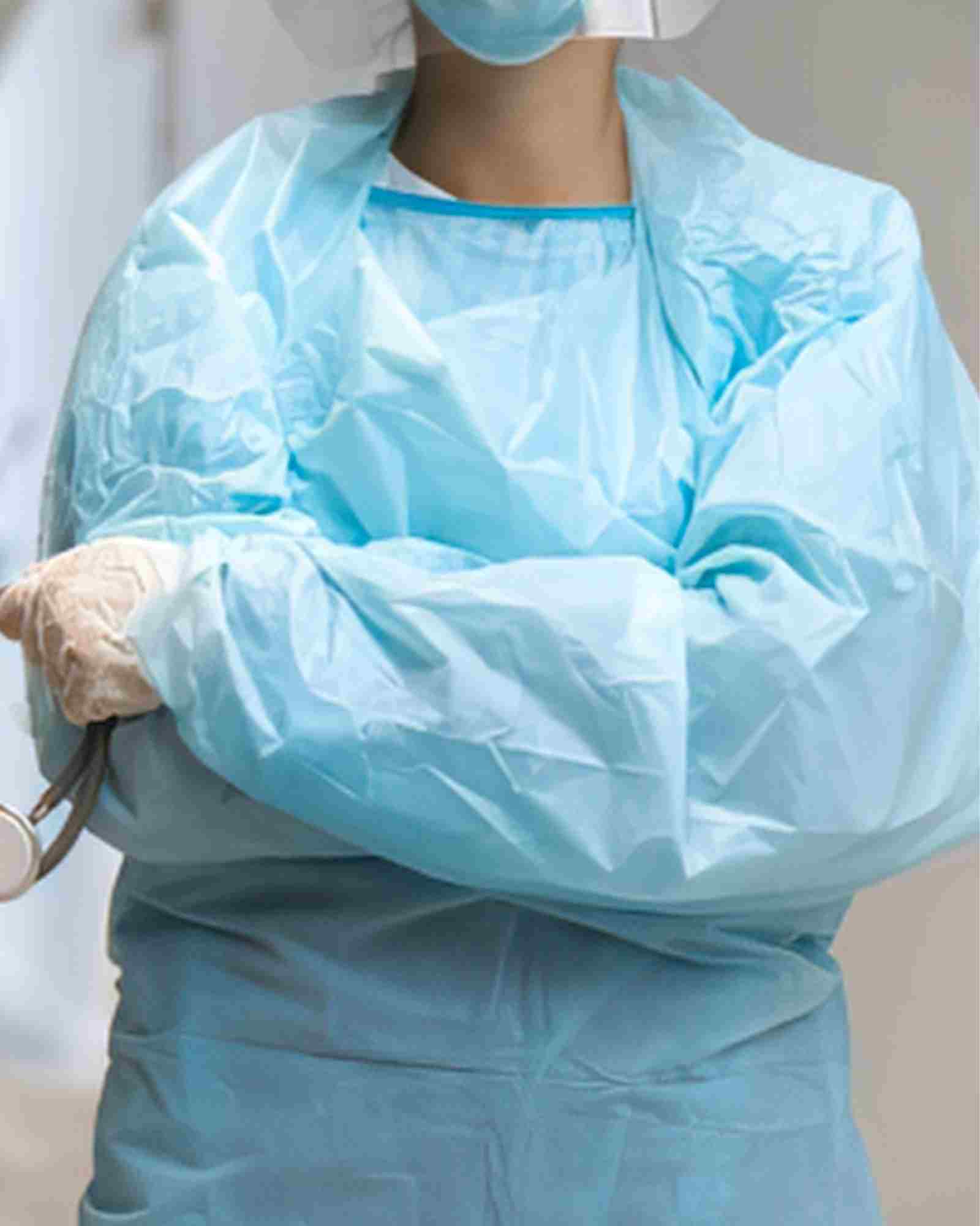 Nurse in white coat in a French hospital corridor